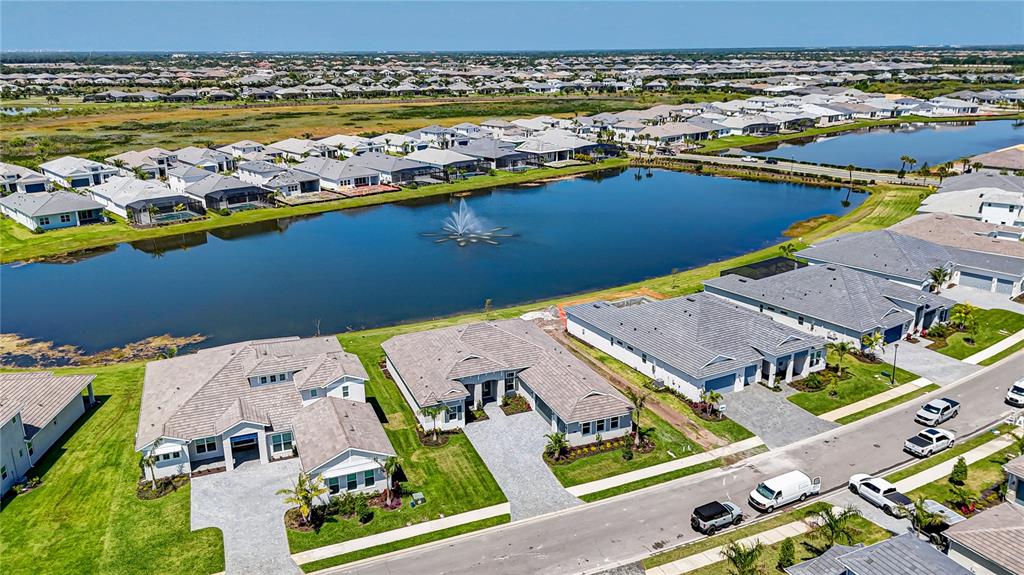 8218 Nevis Run Lakewood Ranch, FL 34202 - Photo 43 of 48 an aerial view of residential houses with outdoor space