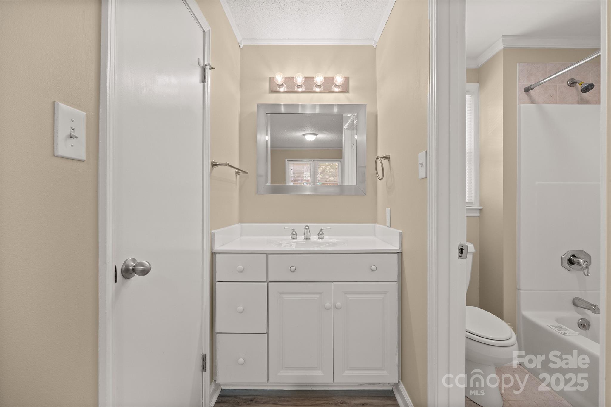 1052 Palmyra Drive Fort Mill, SC 29708 - Photo 17 of 26 a bathroom with a granite countertop sink toilet and shower