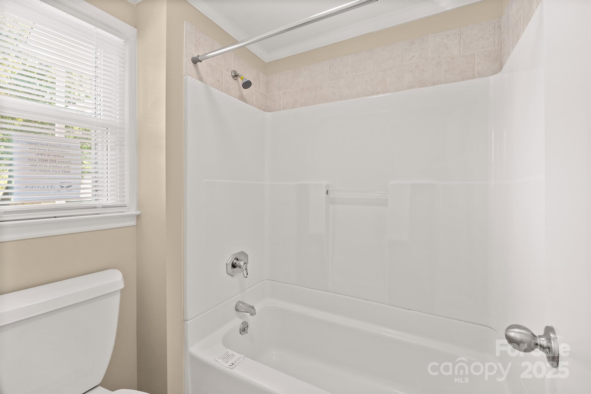 1052 Palmyra Drive Fort Mill, SC 29708 - Photo 19 of 26 a bathroom with a bathtub and a toilet