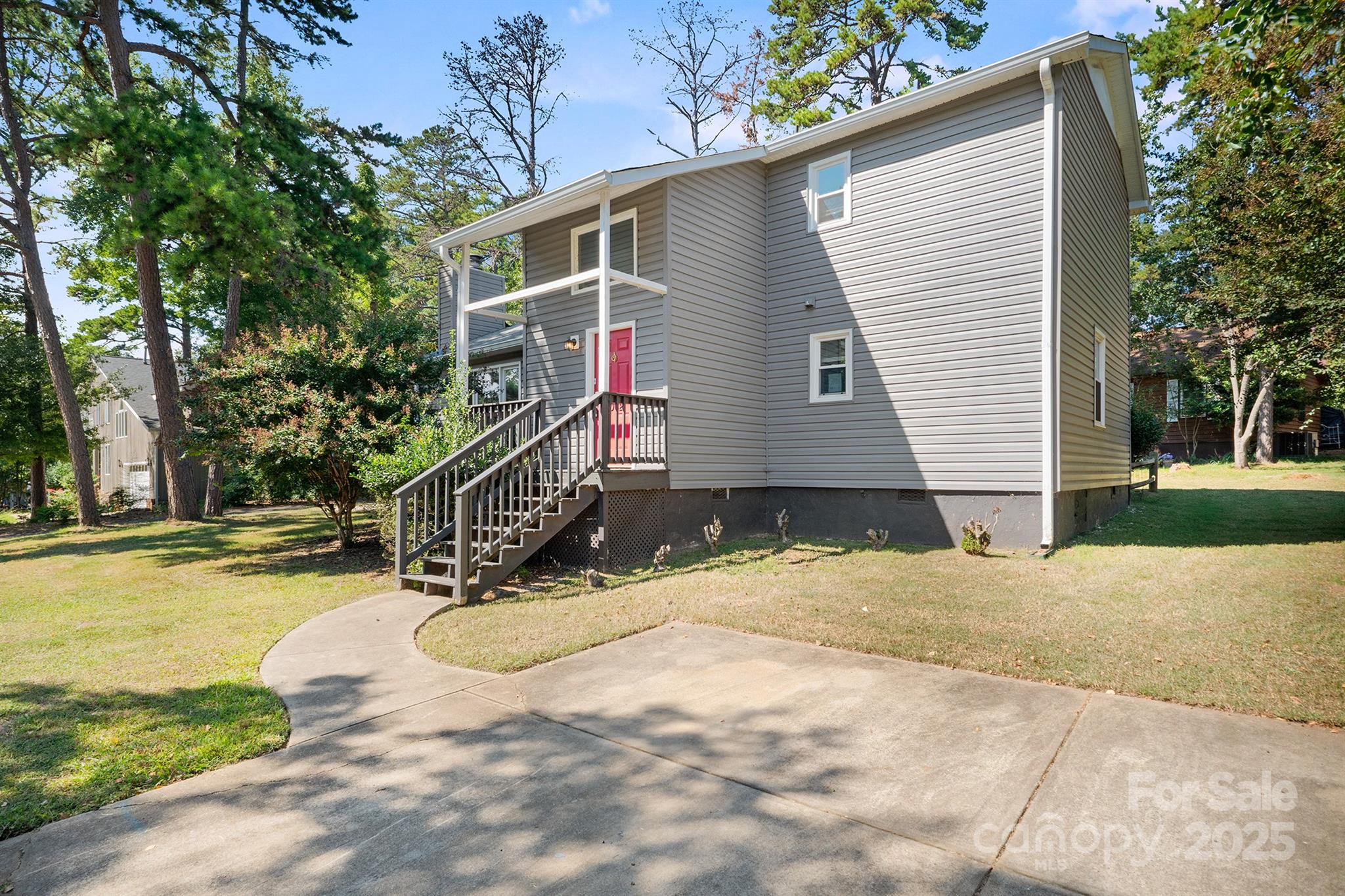 1052 Palmyra Drive Fort Mill, SC 29708 - Photo 2 of 26 a view of a house with a yard