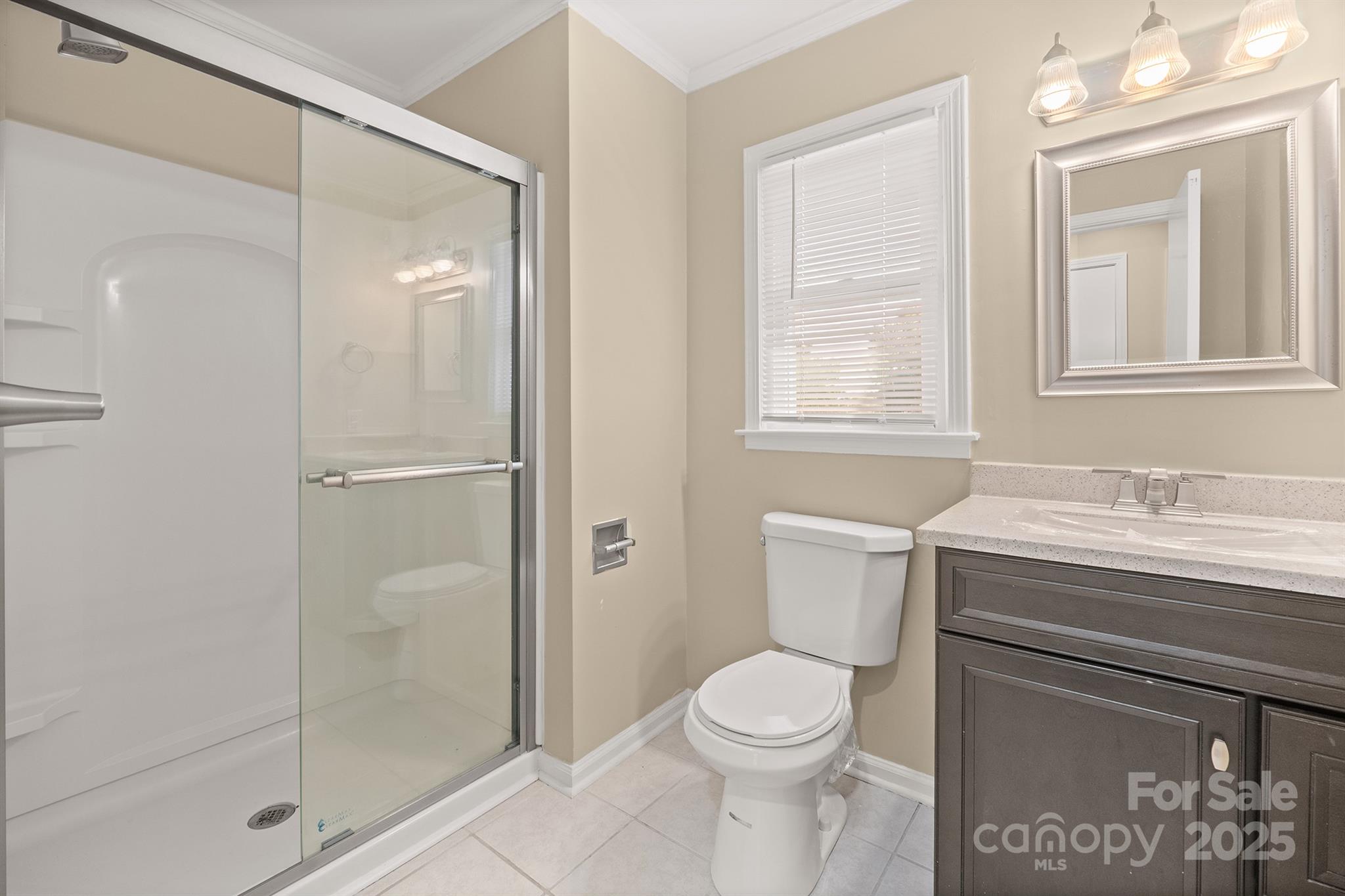 1052 Palmyra Drive Fort Mill, SC 29708 - Photo 25 of 26 a bathroom with a granite countertop sink toilet and shower