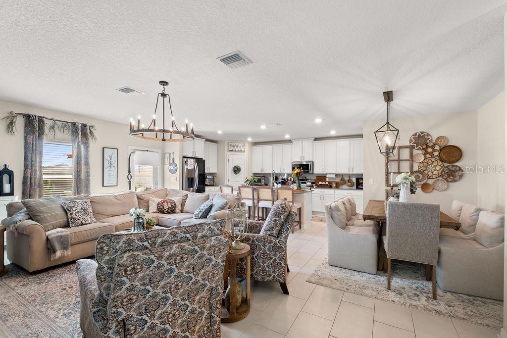 2821 Muller Oak Loop Ocoee, FL 34761 - Photo 11 of 45 a living room with furniture chandelier and a chandelier
