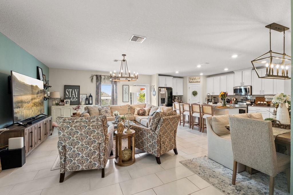 2821 Muller Oak Loop Ocoee, FL 34761 - Photo 12 of 45 a living room with furniture and a flat screen tv