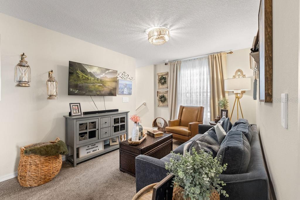 2821 Muller Oak Loop Ocoee, FL 34761 - Photo 19 of 45 a living room with furniture and a flat screen tv