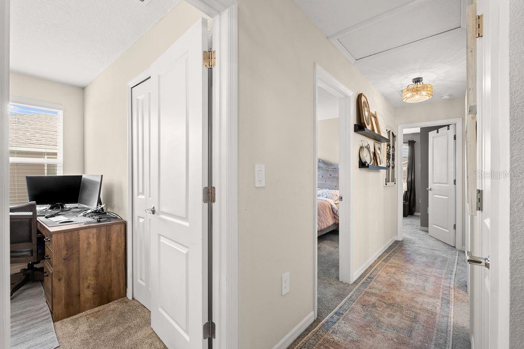 2821 Muller Oak Loop Ocoee, FL 34761 - Photo 20 of 45 a view of a hallway with workspace and a window