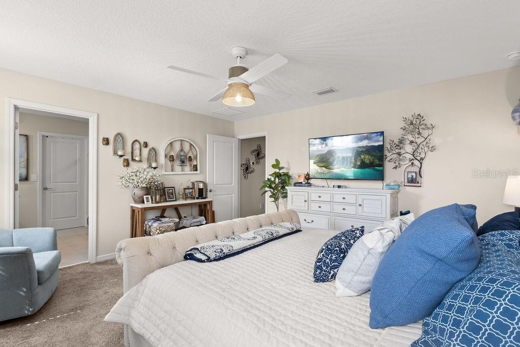 2821 Muller Oak Loop Ocoee, FL 34761 - Photo 23 of 45 a bedroom with a bed and a flat screen tv