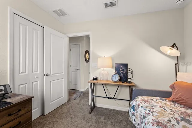 a bedroom with furniture and a window