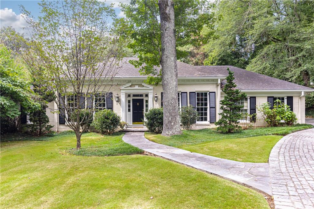 3384 Rilman Road Northwest Atlanta, GA 30327 - Photo 1 of 68 a front view of a house with a yard