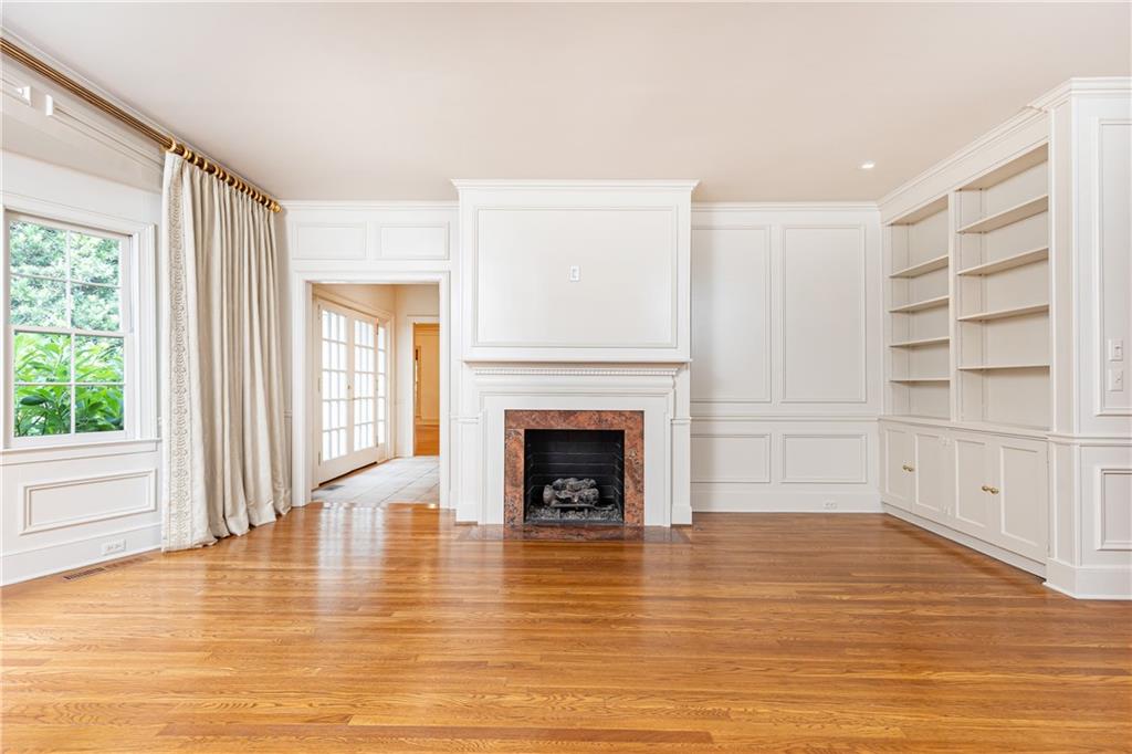 3384 Rilman Road Northwest Atlanta, GA 30327 - Photo 11 of 68 a view of a livingroom with an empty space & a fireplace