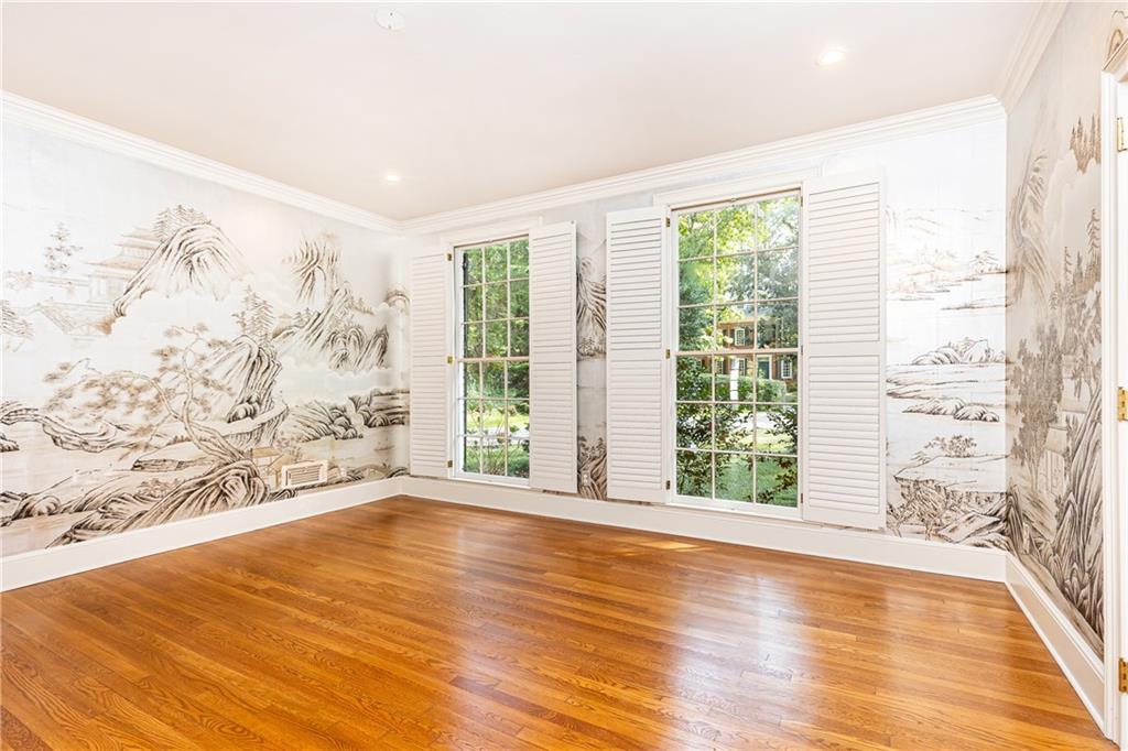 3384 Rilman Road Northwest Atlanta, GA 30327 - Photo 15 of 68 a view of an empty room with wooden floor and a window