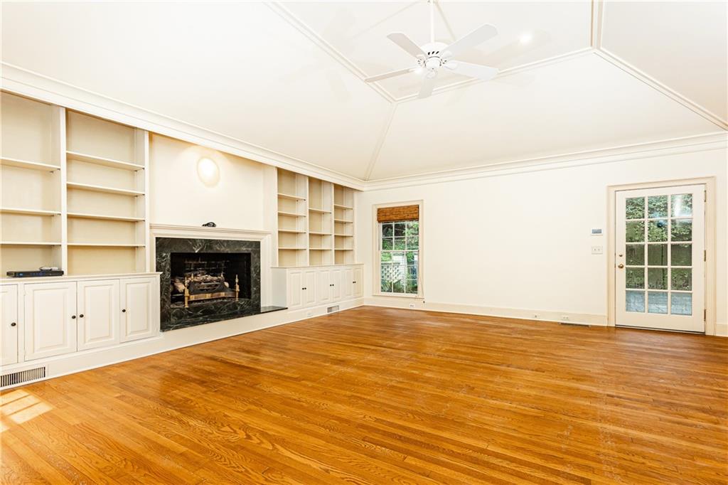 3384 Rilman Road Northwest Atlanta, GA 30327 - Photo 30 of 68 a view of empty room with a fireplace and fan