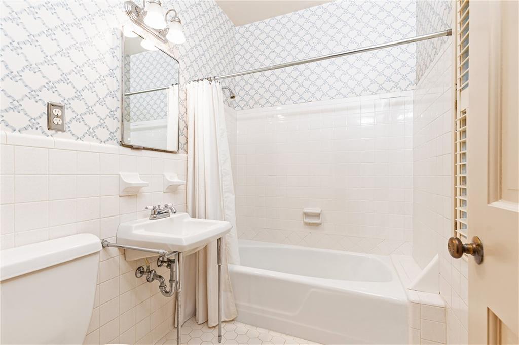 3384 Rilman Road Northwest Atlanta, GA 30327 - Photo 37 of 68 a bathroom with a sink mirror toilet and bathtub