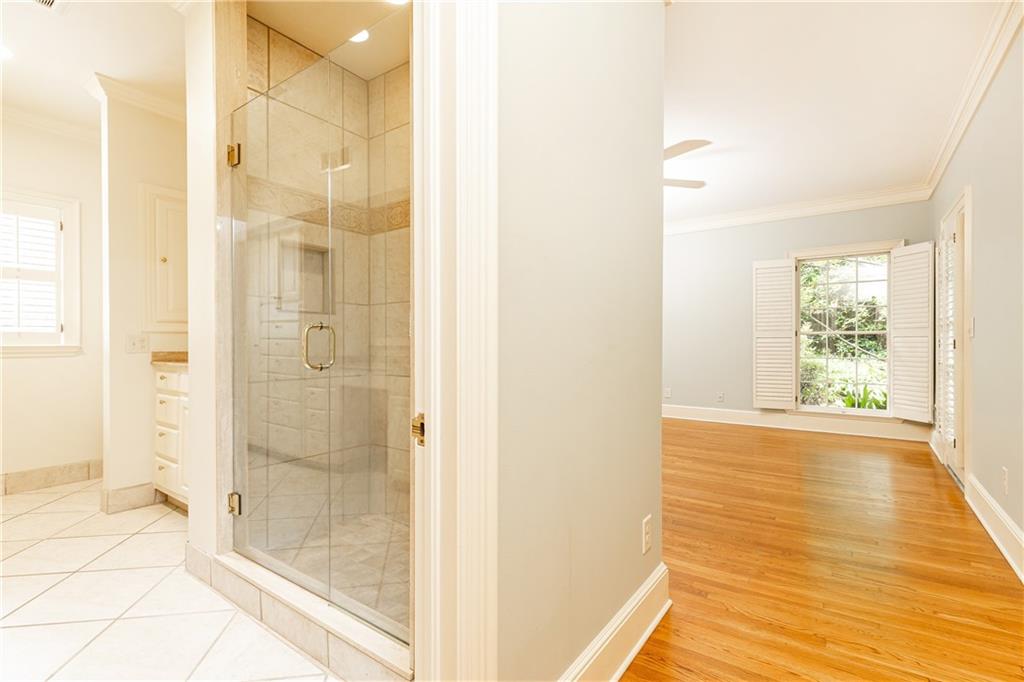 3384 Rilman Road Northwest Atlanta, GA 30327 - Photo 38 of 68 a view of an empty room with wooden floor and a bathroom