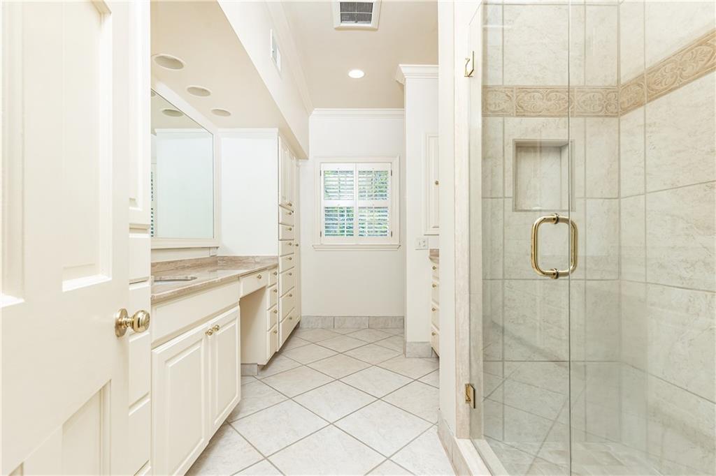3384 Rilman Road Northwest Atlanta, GA 30327 - Photo 39 of 68 a spacious bathroom with a double vanity sink a mirror and a shower