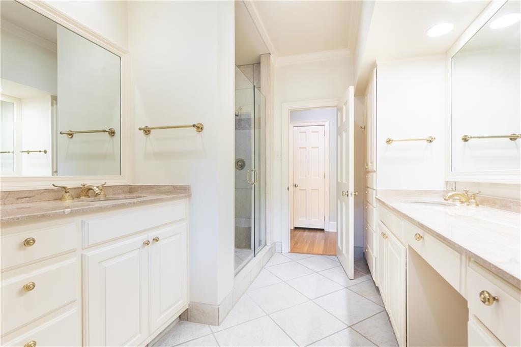 3384 Rilman Road Northwest Atlanta, GA 30327 - Photo 40 of 68 a spacious bathroom with a granite countertop sink a mirror and a
