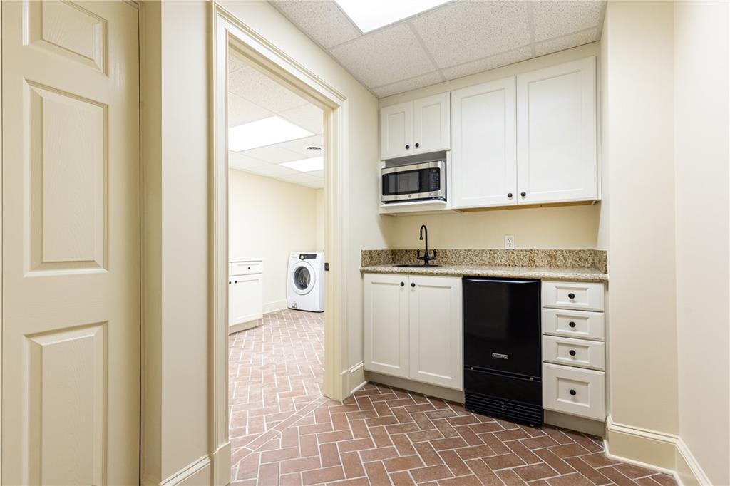 3384 Rilman Road Northwest Atlanta, GA 30327 - Photo 53 of 68 a kitchen with granite countertop a refrigerator and a stove