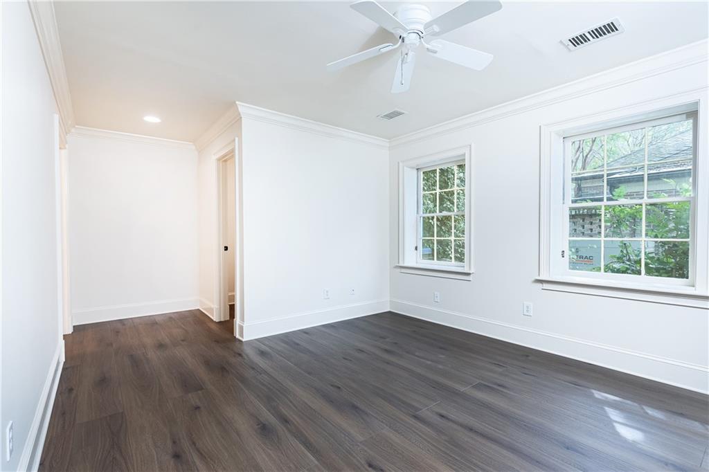 3384 Rilman Road Northwest Atlanta, GA 30327 - Photo 56 of 68 a view of an empty room with wooden floor and a window