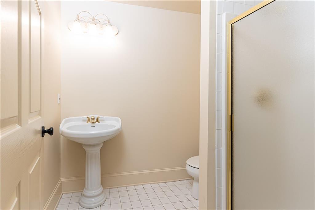 3384 Rilman Road Northwest Atlanta, GA 30327 - Photo 58 of 68 a bathroom with a sink and toilet