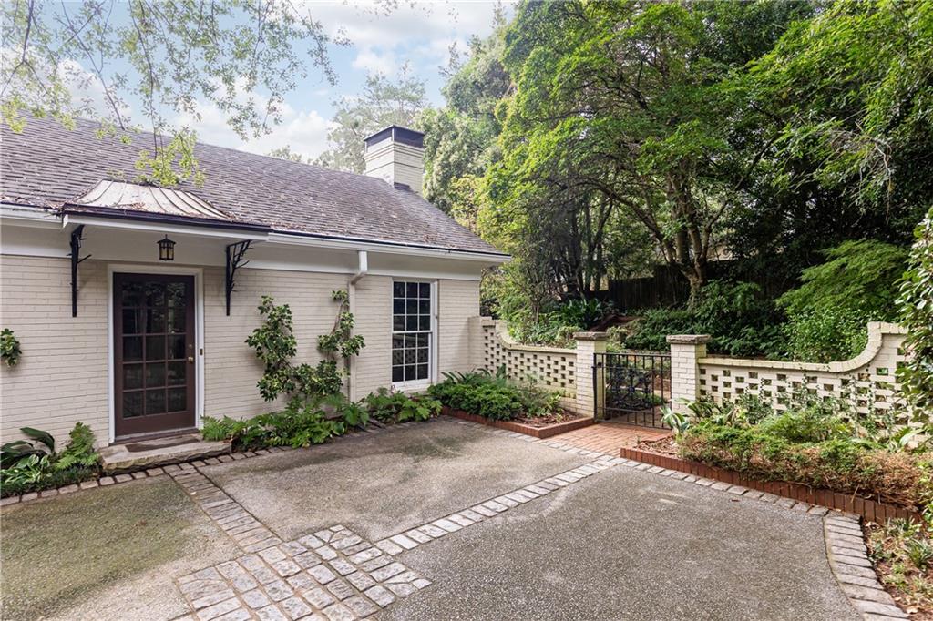 3384 Rilman Road Northwest Atlanta, GA 30327 - Photo 62 of 68 a front view of a house with garden