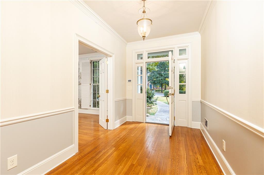 3384 Rilman Road Northwest Atlanta, GA 30327 - Photo 8 of 68 a view of an empty room with wooden floor and a window