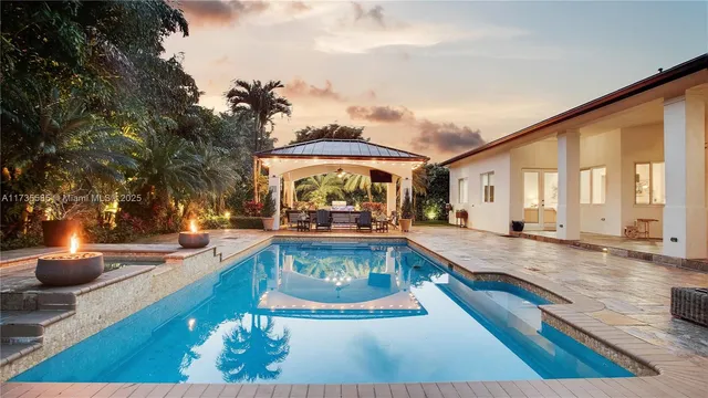 a view of a swimming pool with lounge chair