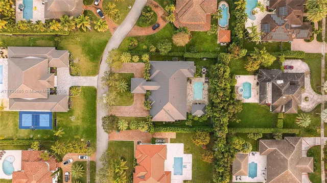 an aerial view of a houses with yard