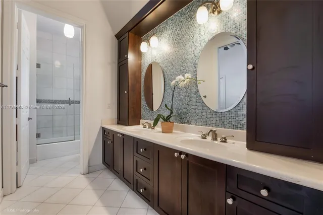a bathroom with a double vanity sink mirror and double