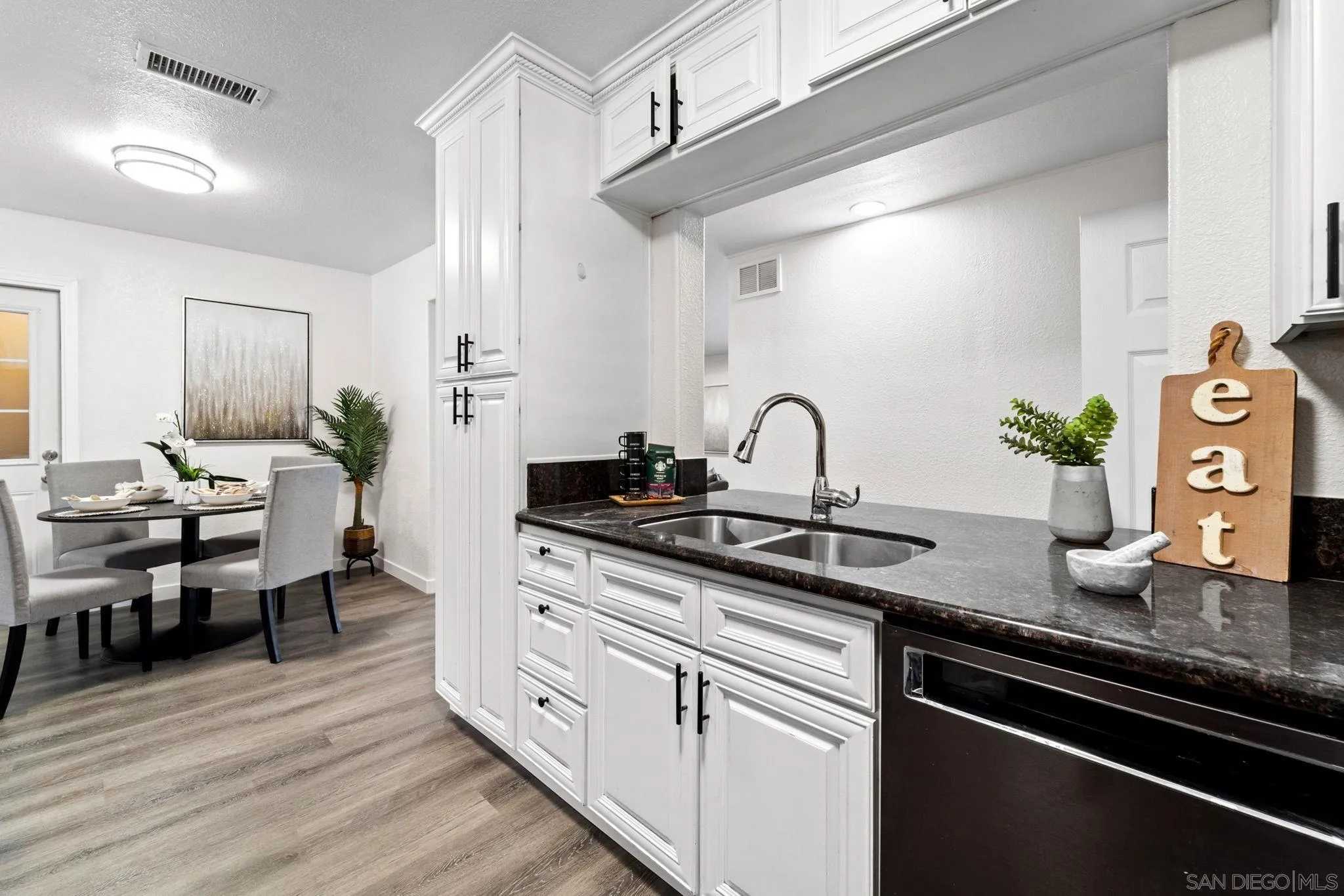 564 Broadview Street Spring Valley, CA 91977 - Photo 12 of 53 a kitchen with sink stove and cabinets