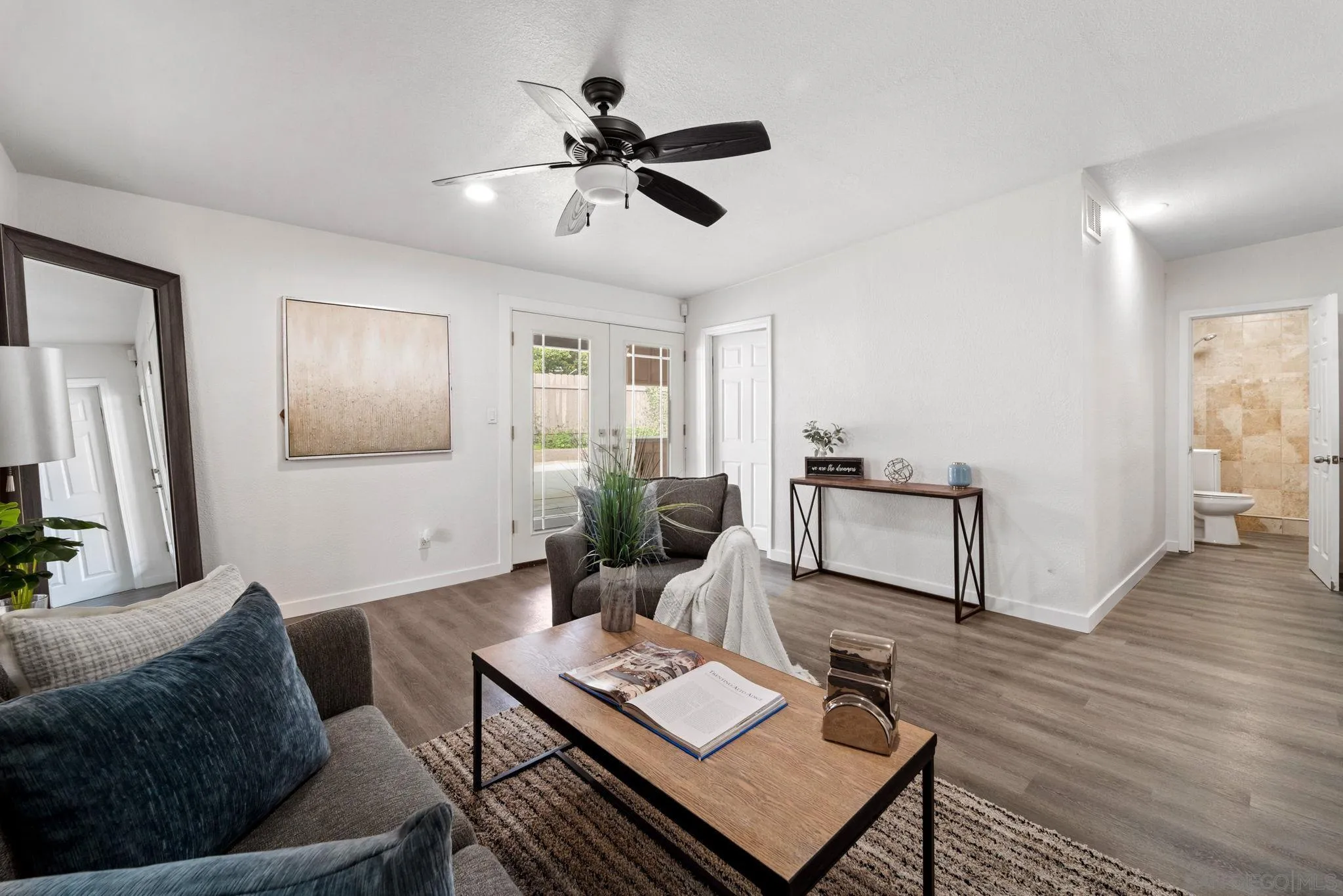 564 Broadview Street Spring Valley, CA 91977 - Photo 16 of 53 a living room with furniture and a wooden floor