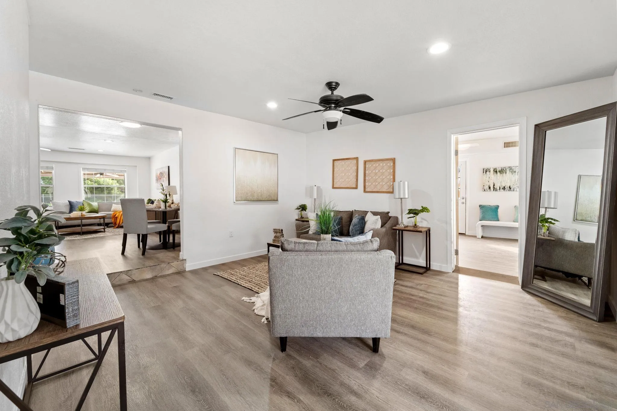 564 Broadview Street Spring Valley, CA 91977 - Photo 17 of 53 a living room with furniture and a wooden floor