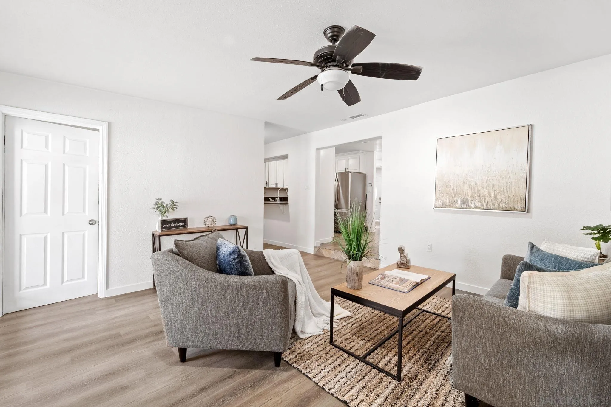 564 Broadview Street Spring Valley, CA 91977 - Photo 18 of 53 a living room with furniture and a wooden floor