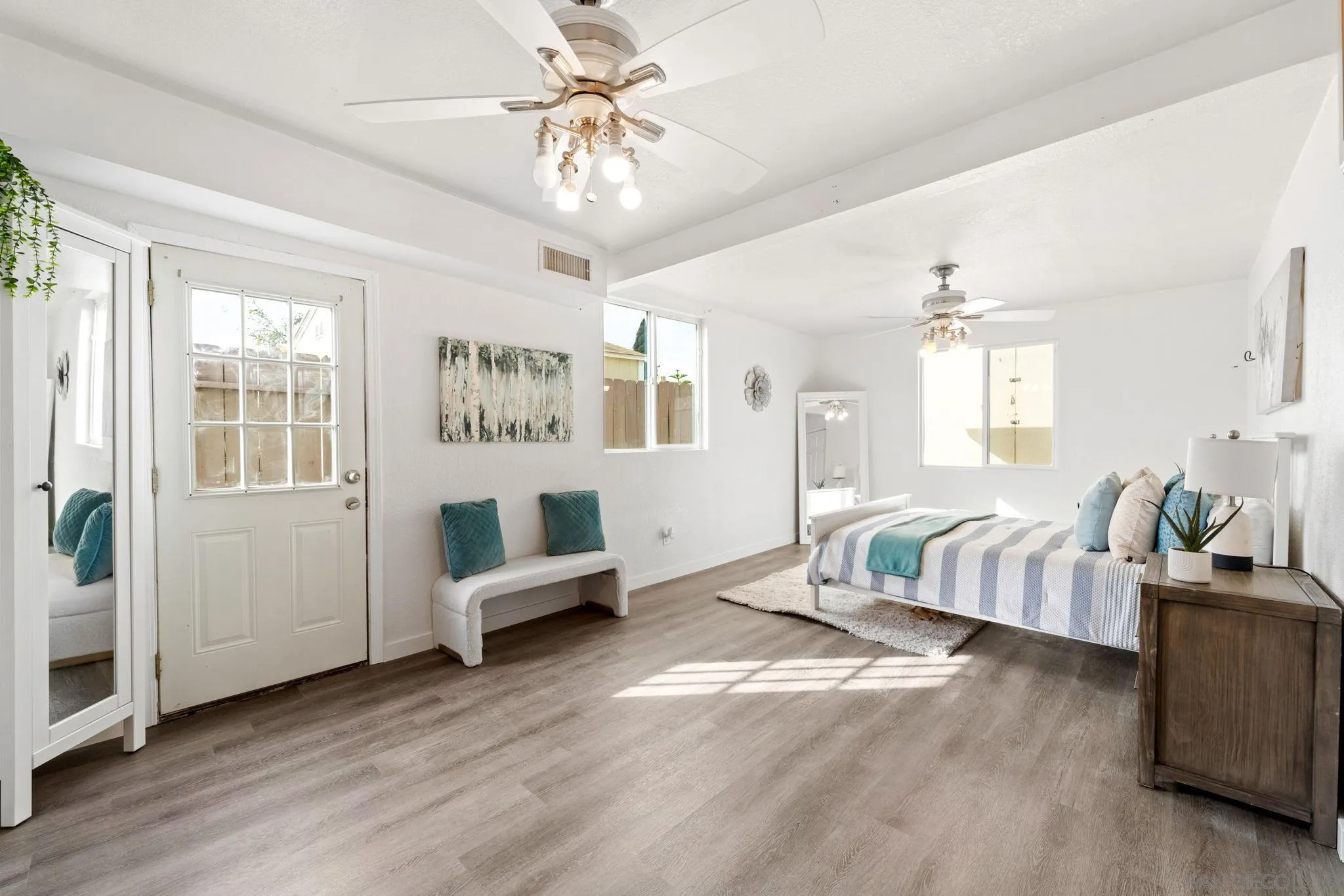 564 Broadview Street Spring Valley, CA 91977 - Photo 19 of 53 a spacious bedroom with a bed couch and window