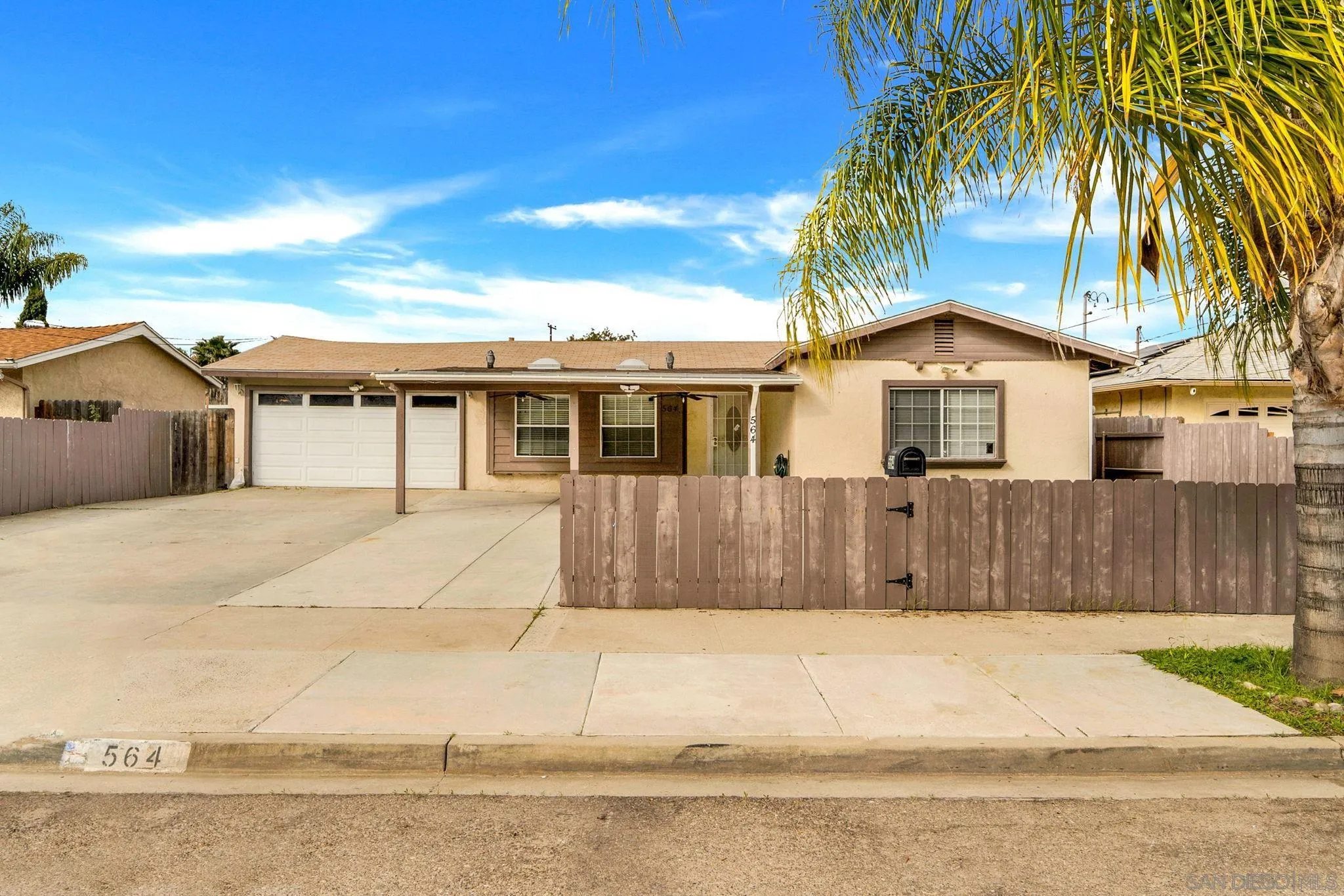 564 Broadview Street Spring Valley, CA 91977 - Photo 2 of 53 a front view of a house with a yard and potted plants