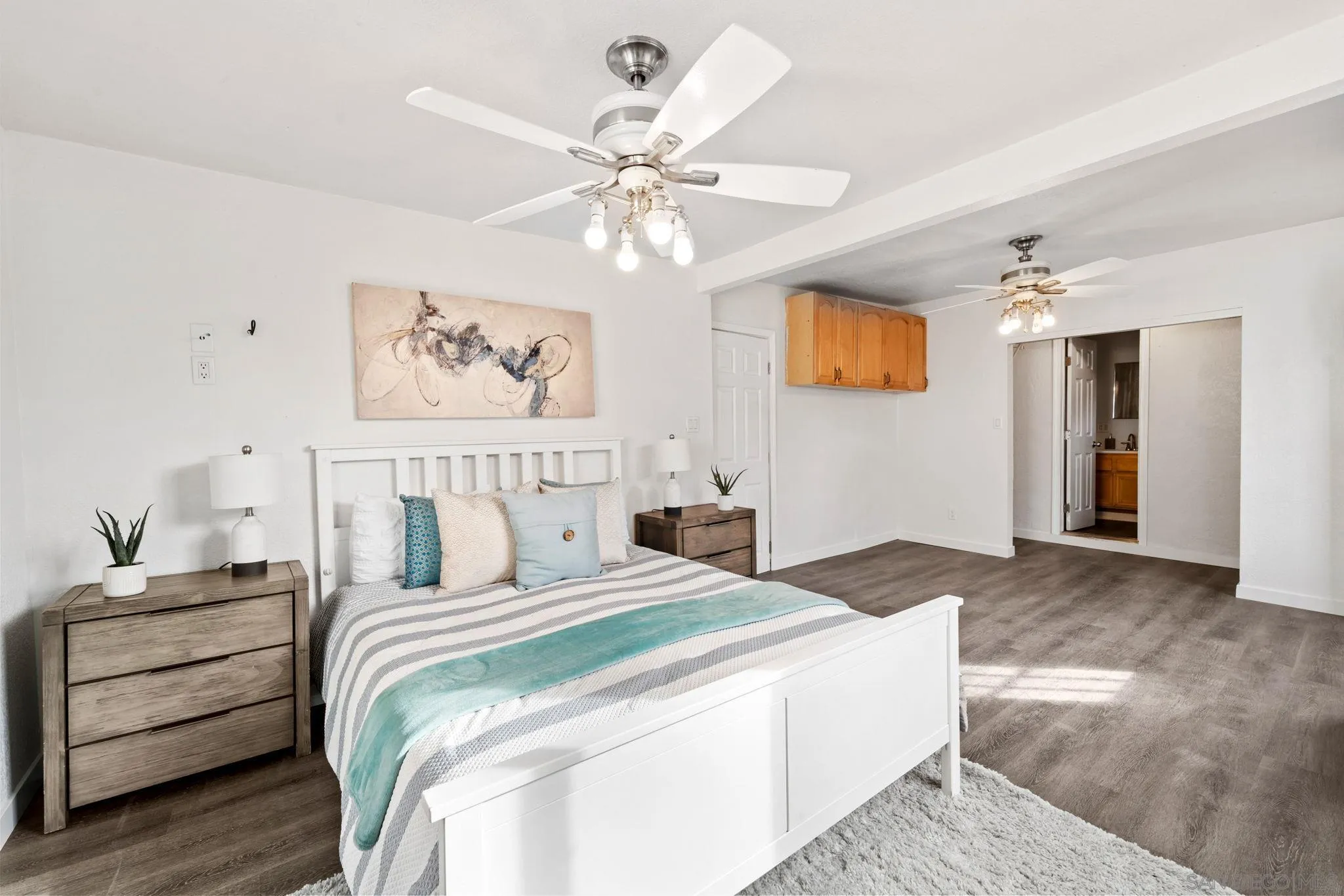 564 Broadview Street Spring Valley, CA 91977 - Photo 21 of 53 a bedroom with bed and a chandelier