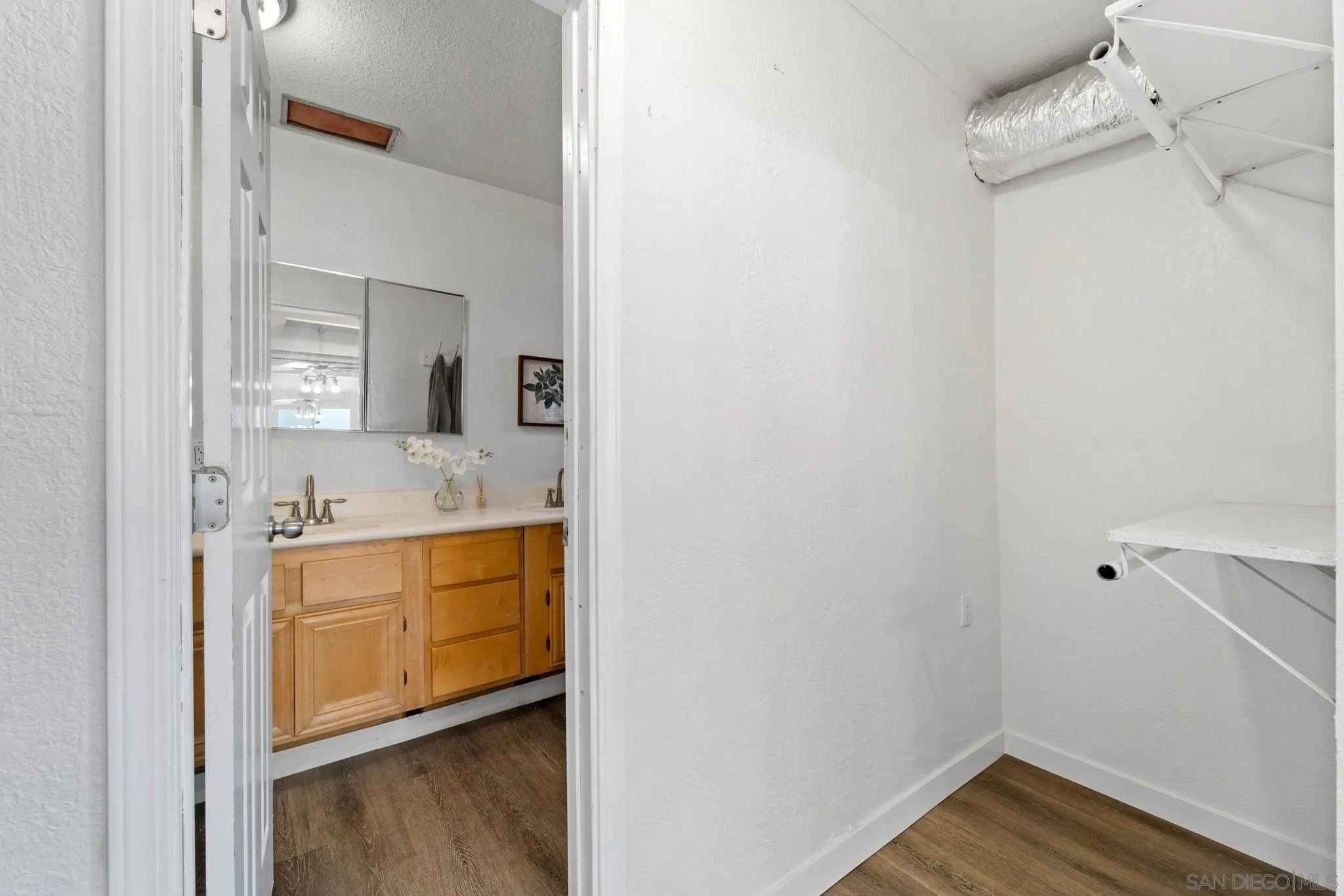 564 Broadview Street Spring Valley, CA 91977 - Photo 22 of 53 a bathroom with a sink and a mirror