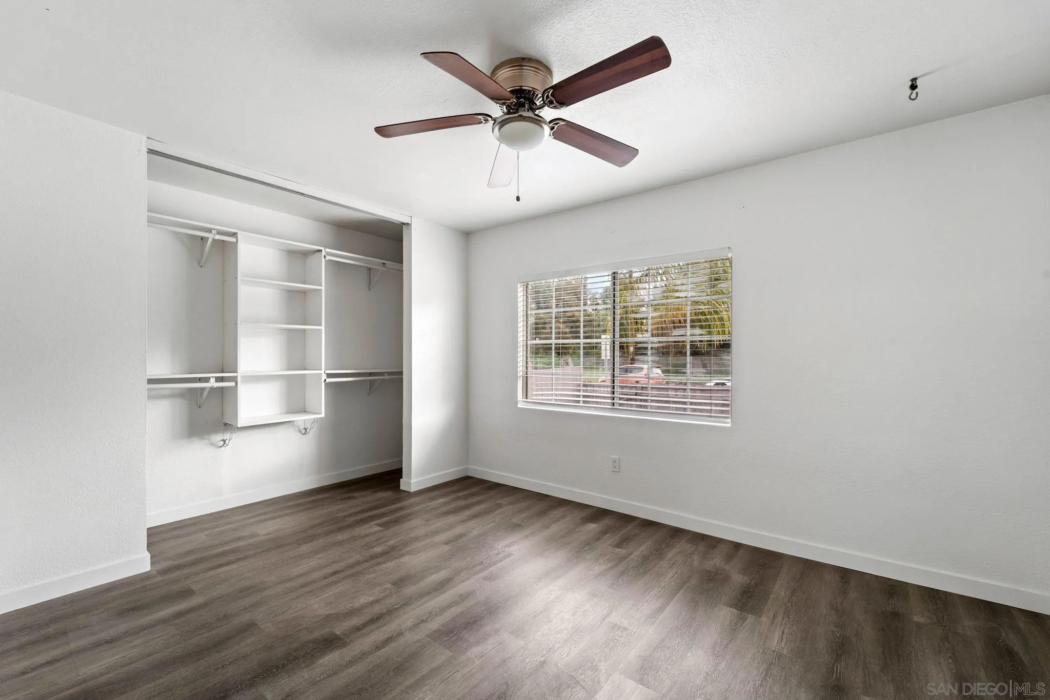 564 Broadview Street Spring Valley, CA 91977 - Photo 26 of 53 a view of an empty room with wooden floor and a window