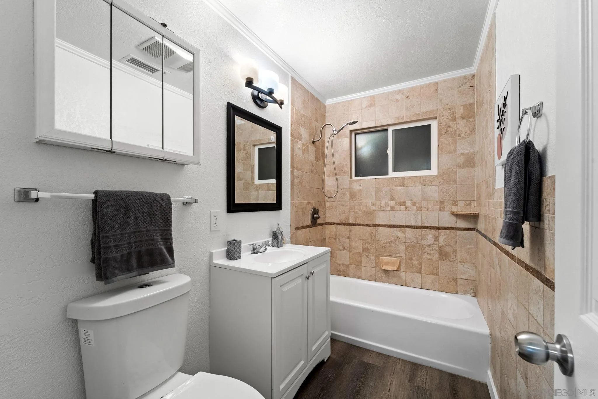 564 Broadview Street Spring Valley, CA 91977 - Photo 29 of 53 a bathroom with a sink a toilet and bathtub