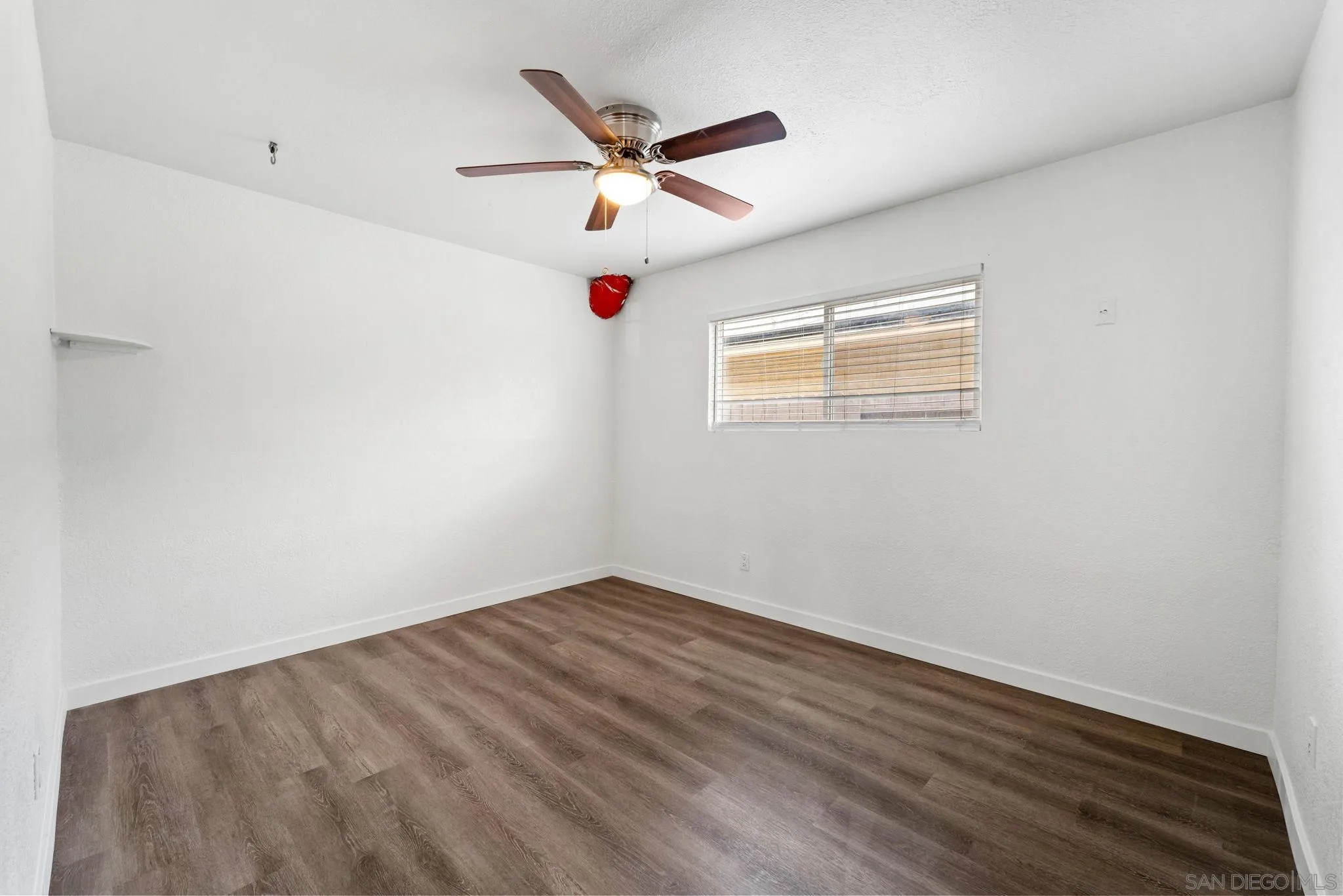 564 Broadview Street Spring Valley, CA 91977 - Photo 30 of 53 an empty room with ceiling fan and window