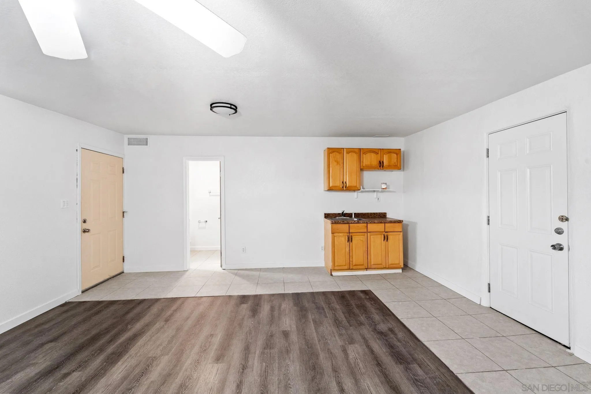 564 Broadview Street Spring Valley, CA 91977 - Photo 38 of 53 an empty room with wooden floor and window