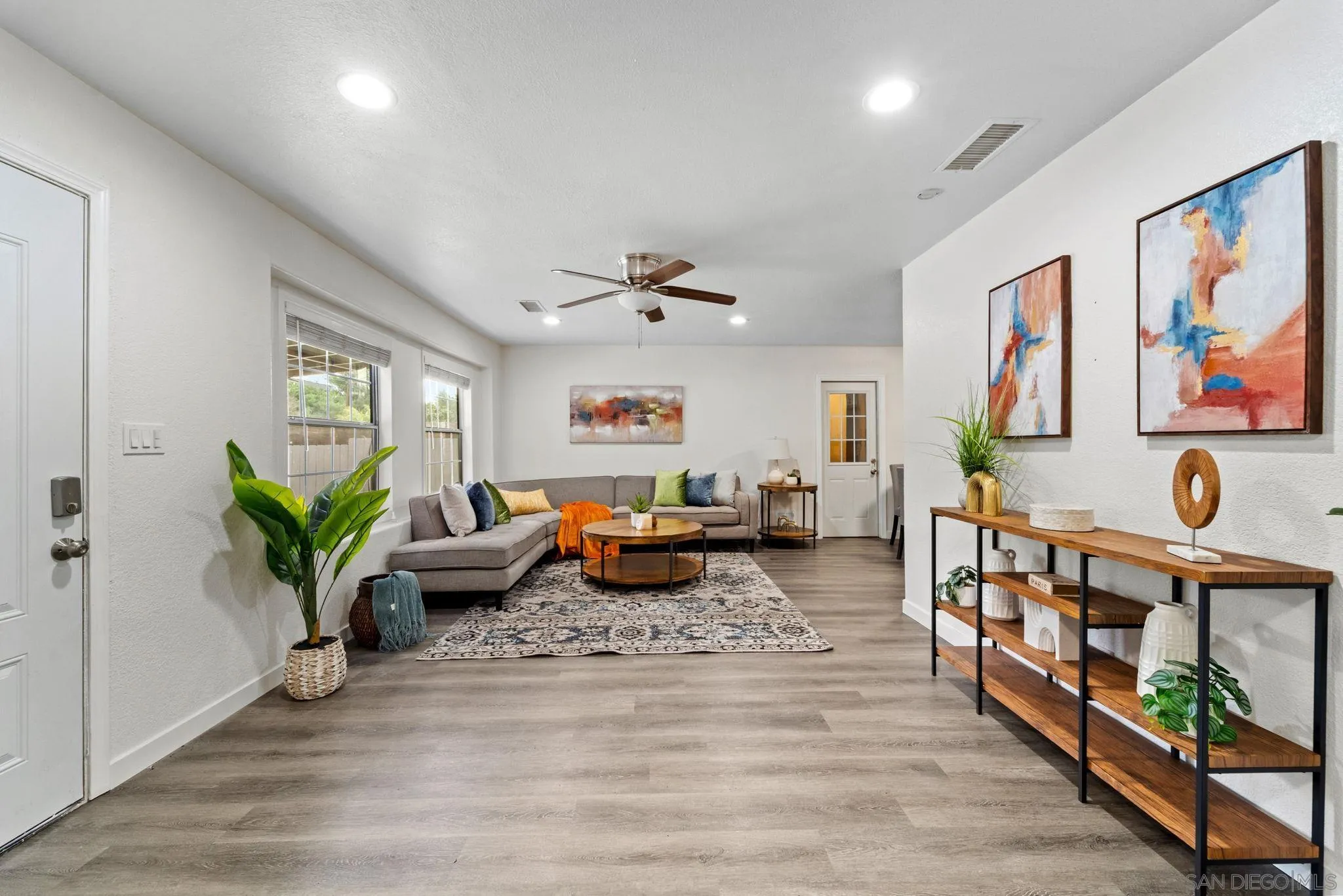 564 Broadview Street Spring Valley, CA 91977 - Photo 4 of 53 a living room with furniture stairs and a potted plant