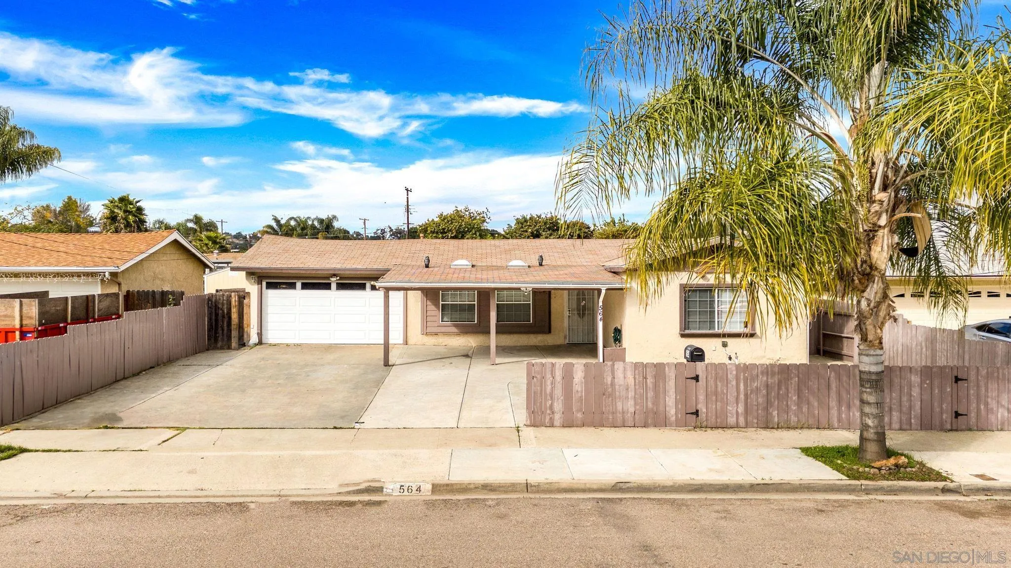 564 Broadview Street Spring Valley, CA 91977 - Photo 48 of 53 a front view of a house with a garden and tree