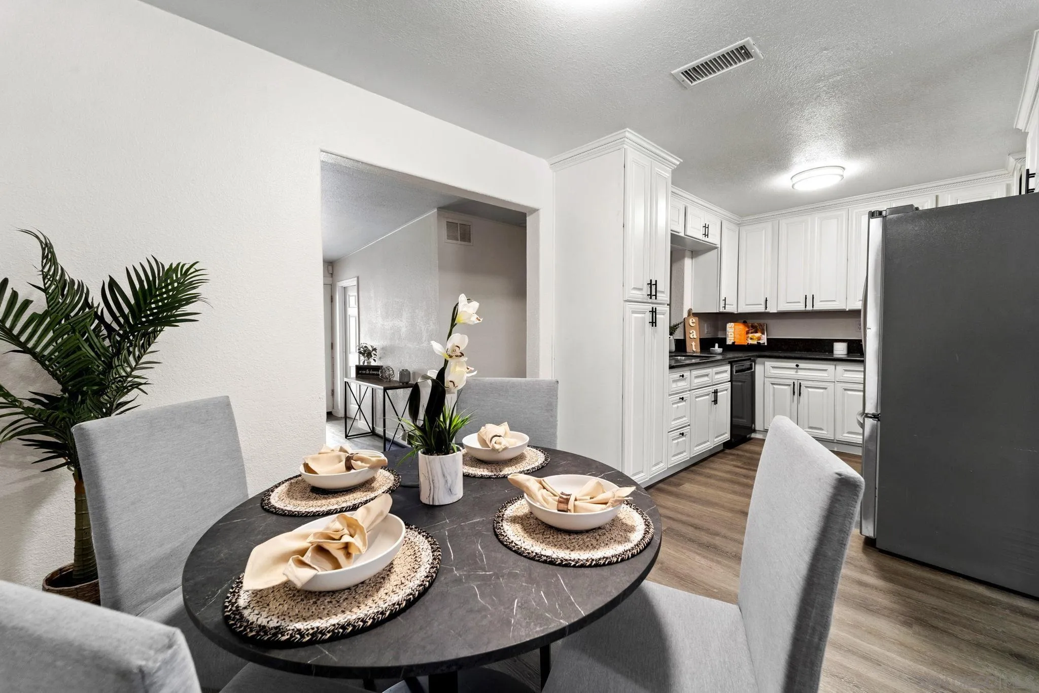 564 Broadview Street Spring Valley, CA 91977 - Photo 8 of 53 a kitchen with furniture and a dining table