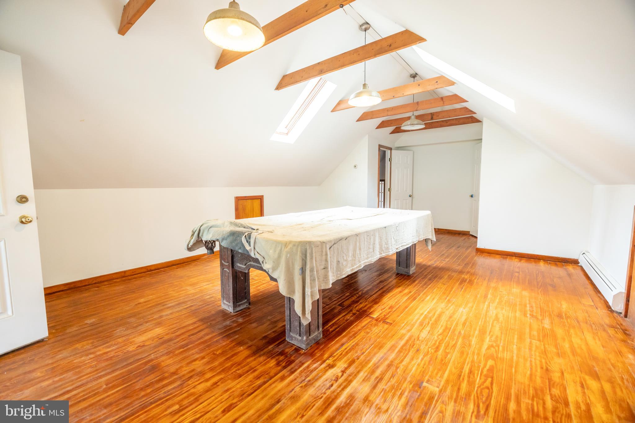 160 Stoney Bank Road Glen Mills, PA 19342 - Photo 25 of 46 a bedroom with a bed and wooden floor