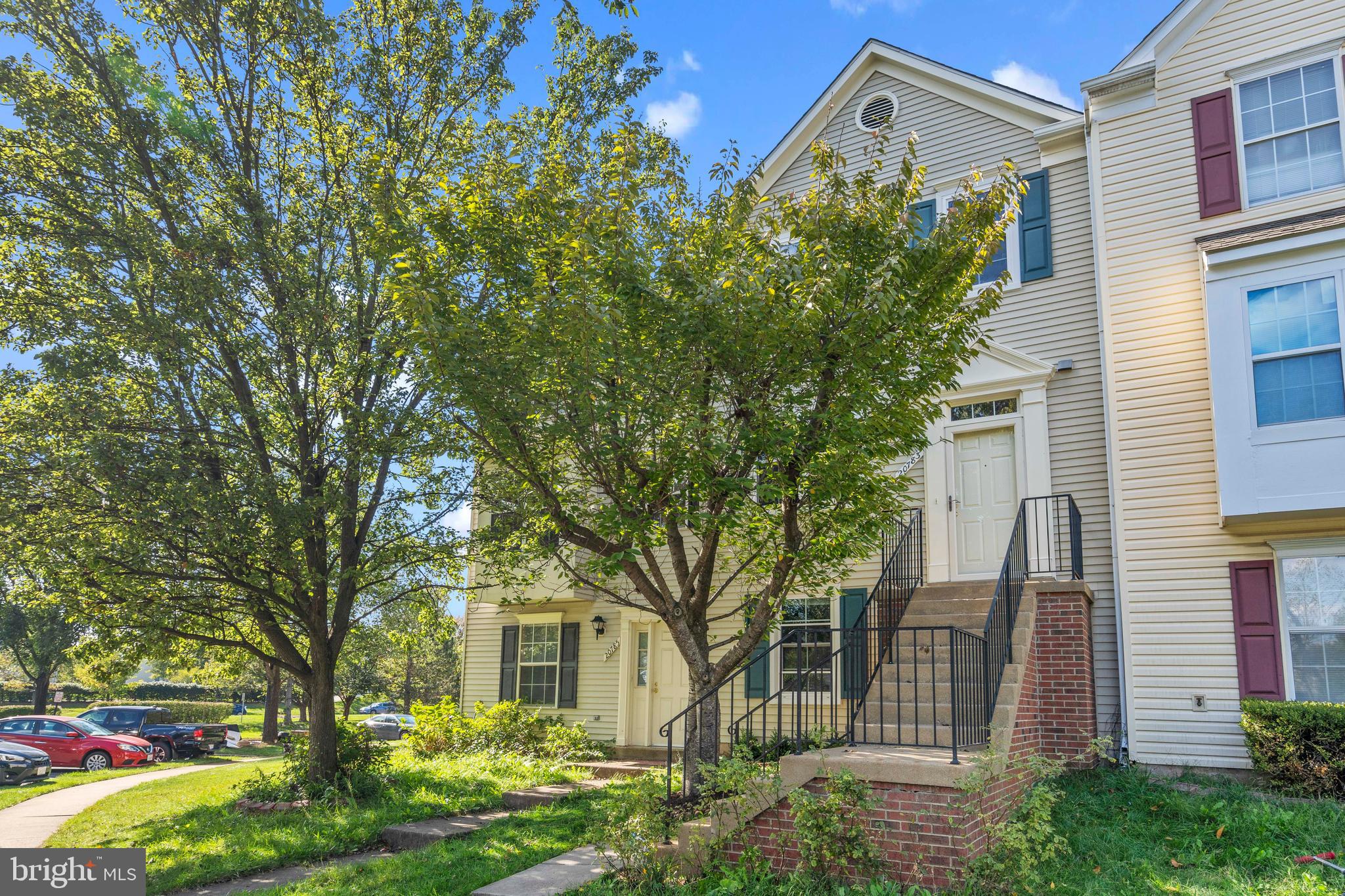 20783 Apollo Terrace Ashburn, VA 20147 - Photo 1 of 33 a front view of a house with garden