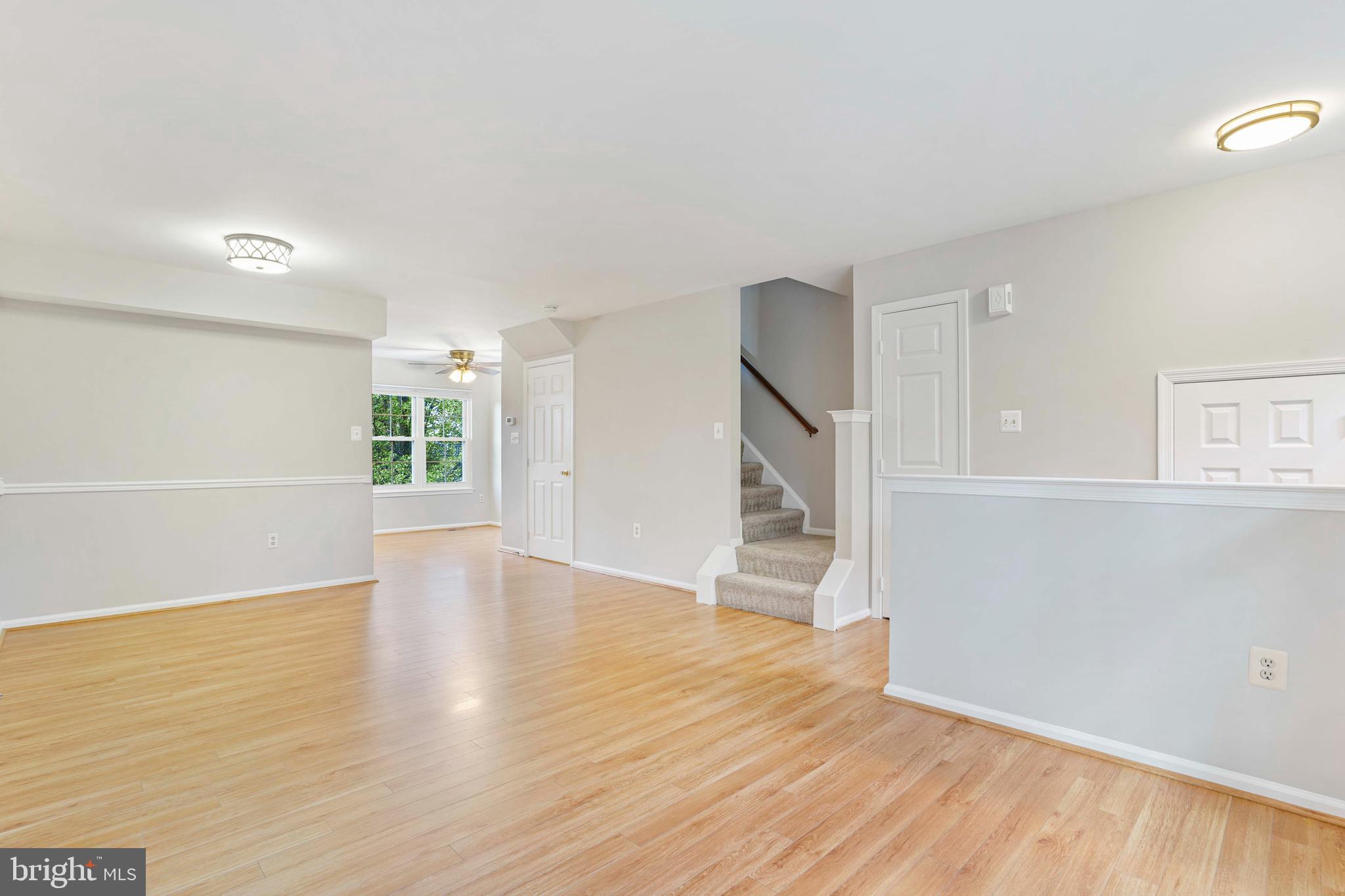 20783 Apollo Terrace Ashburn, VA 20147 - Photo 11 of 33 wooden floor in an empty room with a window