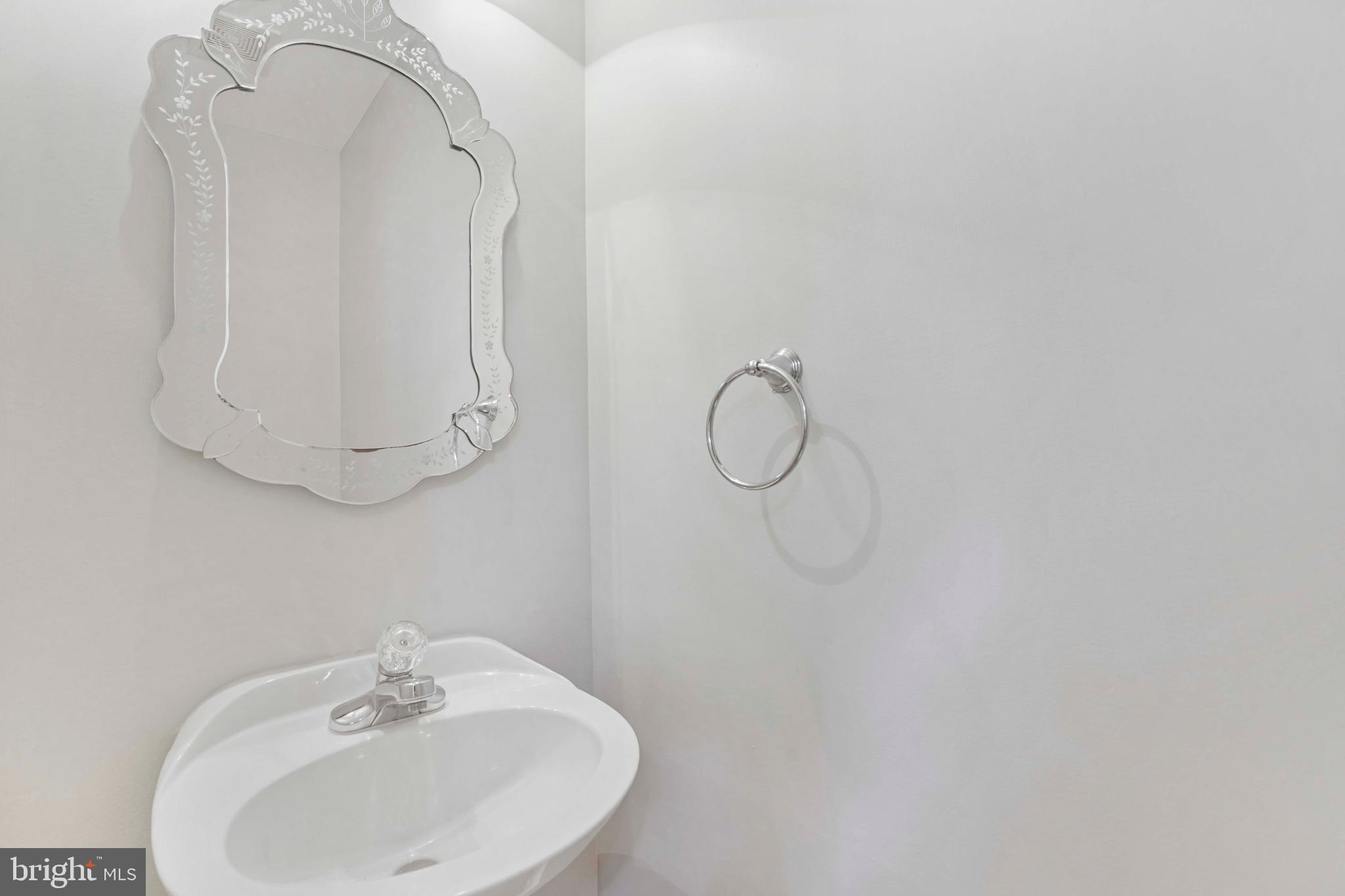 20783 Apollo Terrace Ashburn, VA 20147 - Photo 23 of 33 a bathroom with a sink and a mirror