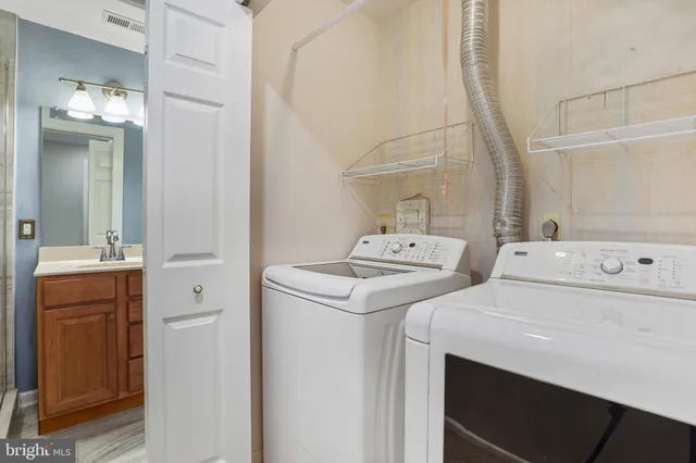 a utility room with dryer and washer