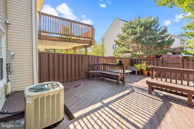a backyard of a house with barbeque oven and outdoor seating