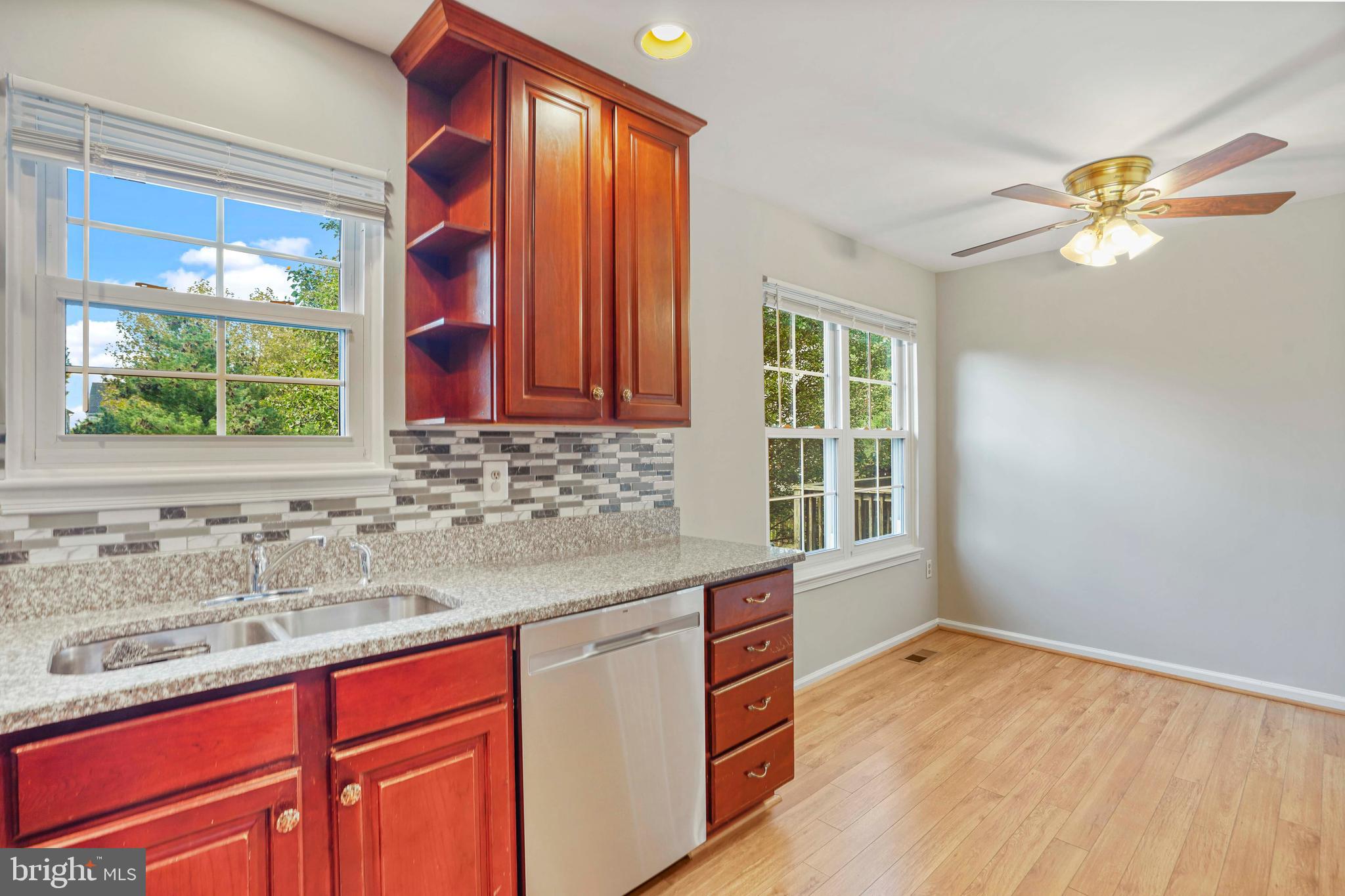 20783 Apollo Terrace Ashburn, VA 20147 - Photo 4 of 33 a kitchen with a sink cabinets and window