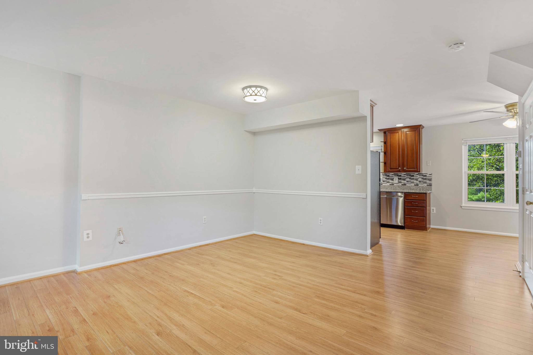 20783 Apollo Terrace Ashburn, VA 20147 - Photo 6 of 33 a view of a kitchen with an empty space and a window